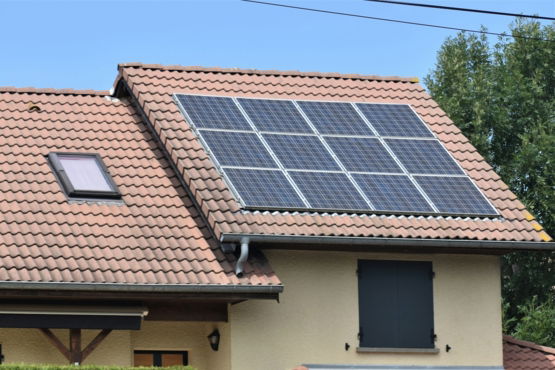 a house with a solar panel on the roof